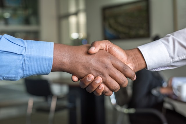 Business handshake in an office