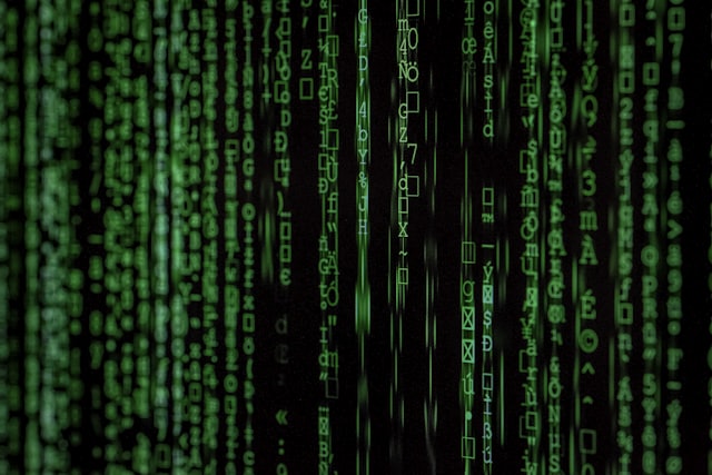 Streams of green code on a dark screen