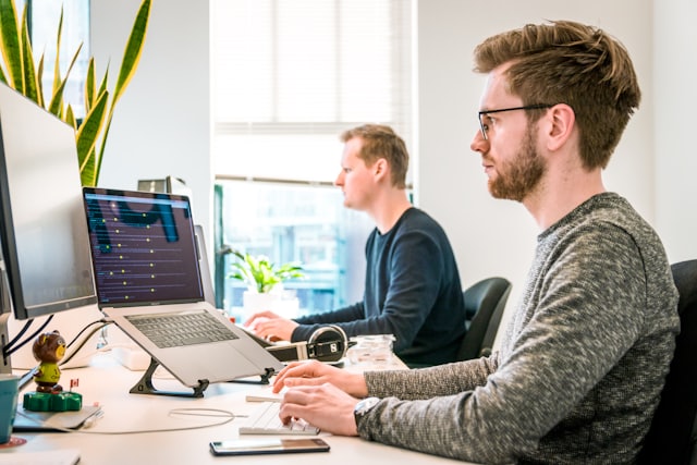 Engineers monitoring systems at desks