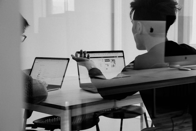 Support team working across laptops